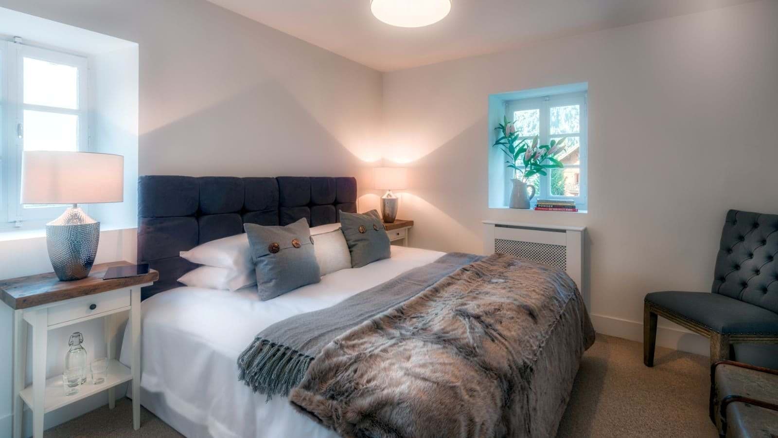 Guest bedroom with queen bed and deep-set window sill