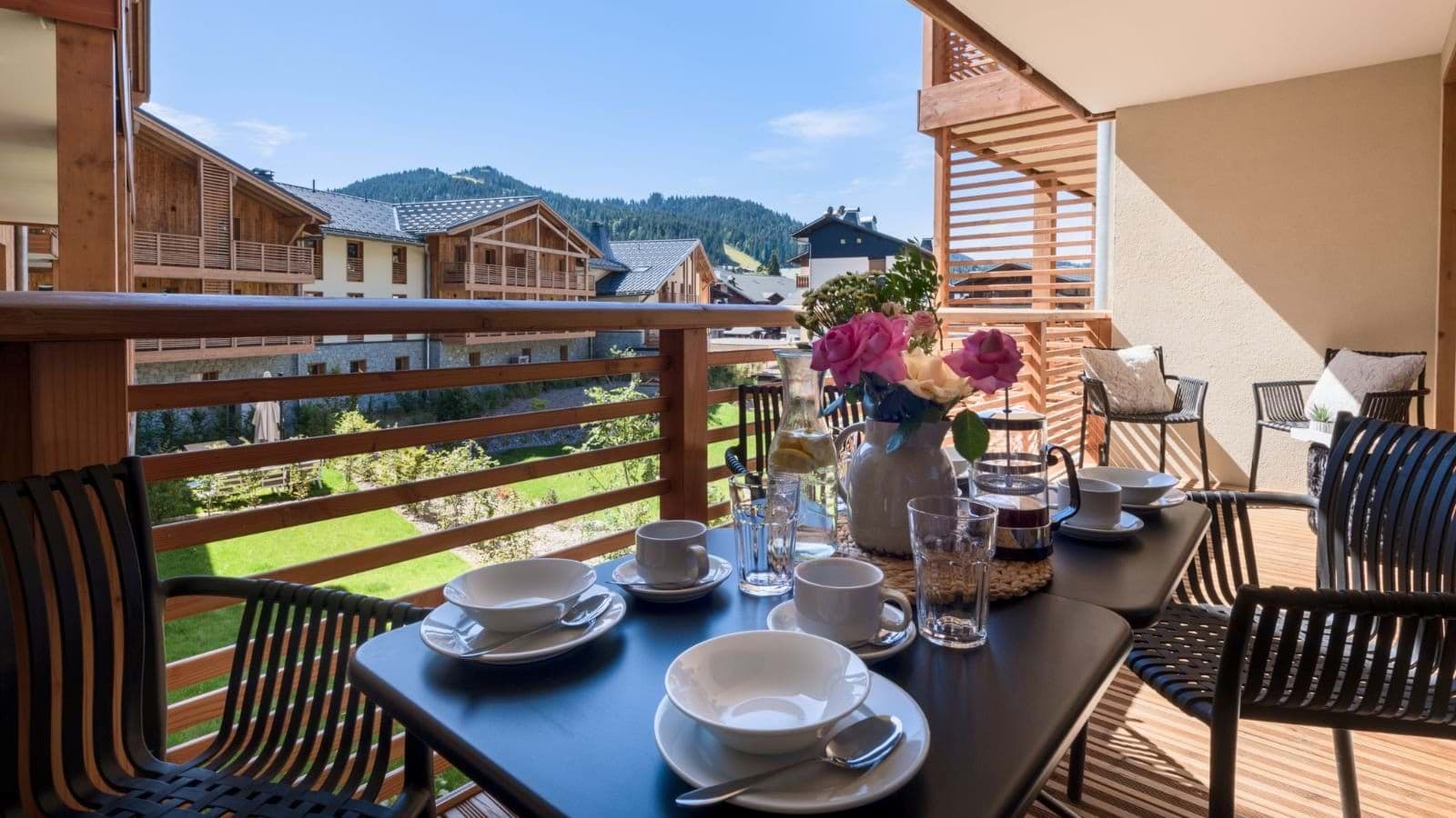 Covered balcony with dining for 4 and village views
