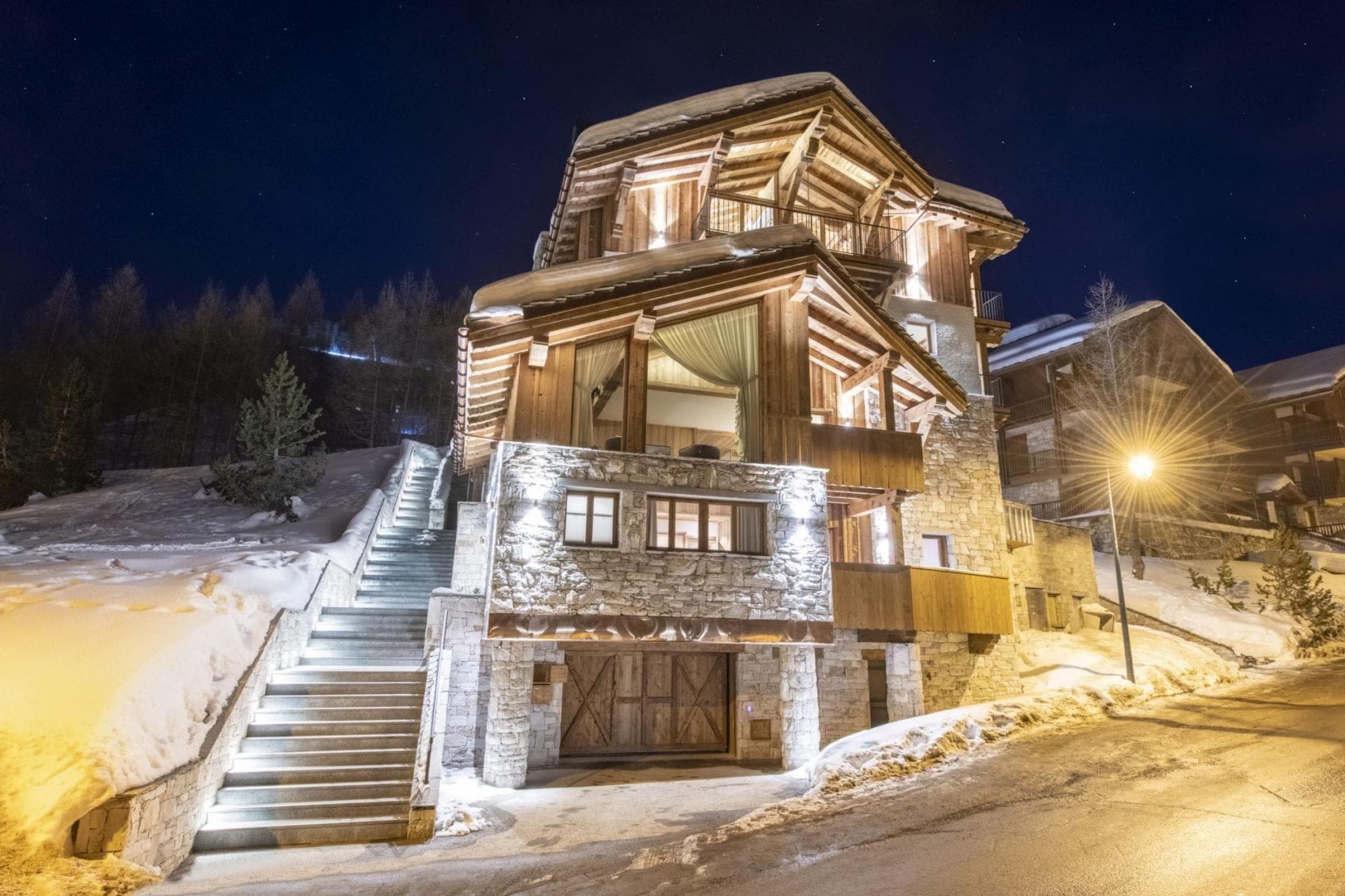 Chalet exterior with heated entry stairs and private garage