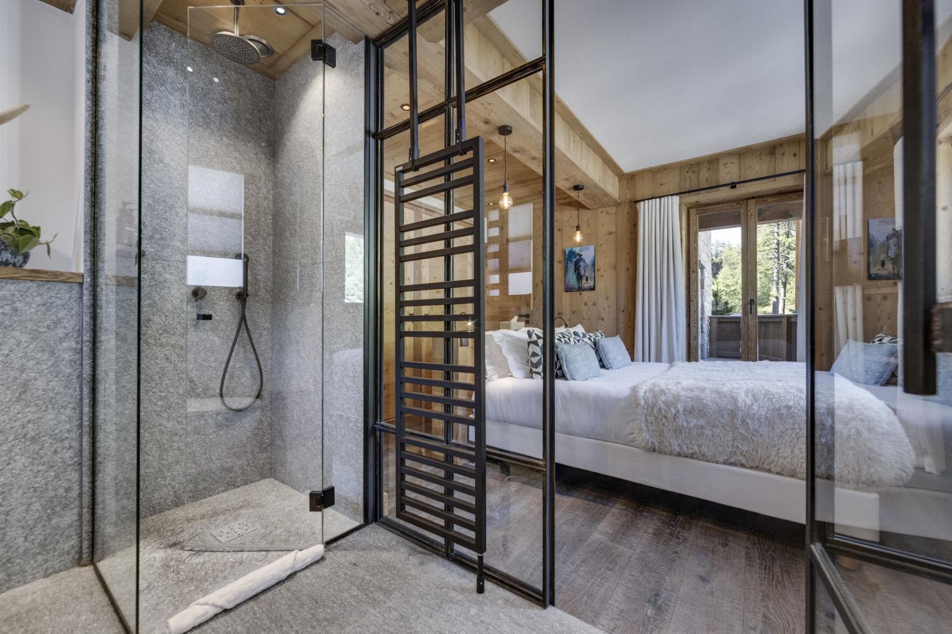 Ensuite bathroom with glass-walled walk-in shower and heated towel rail