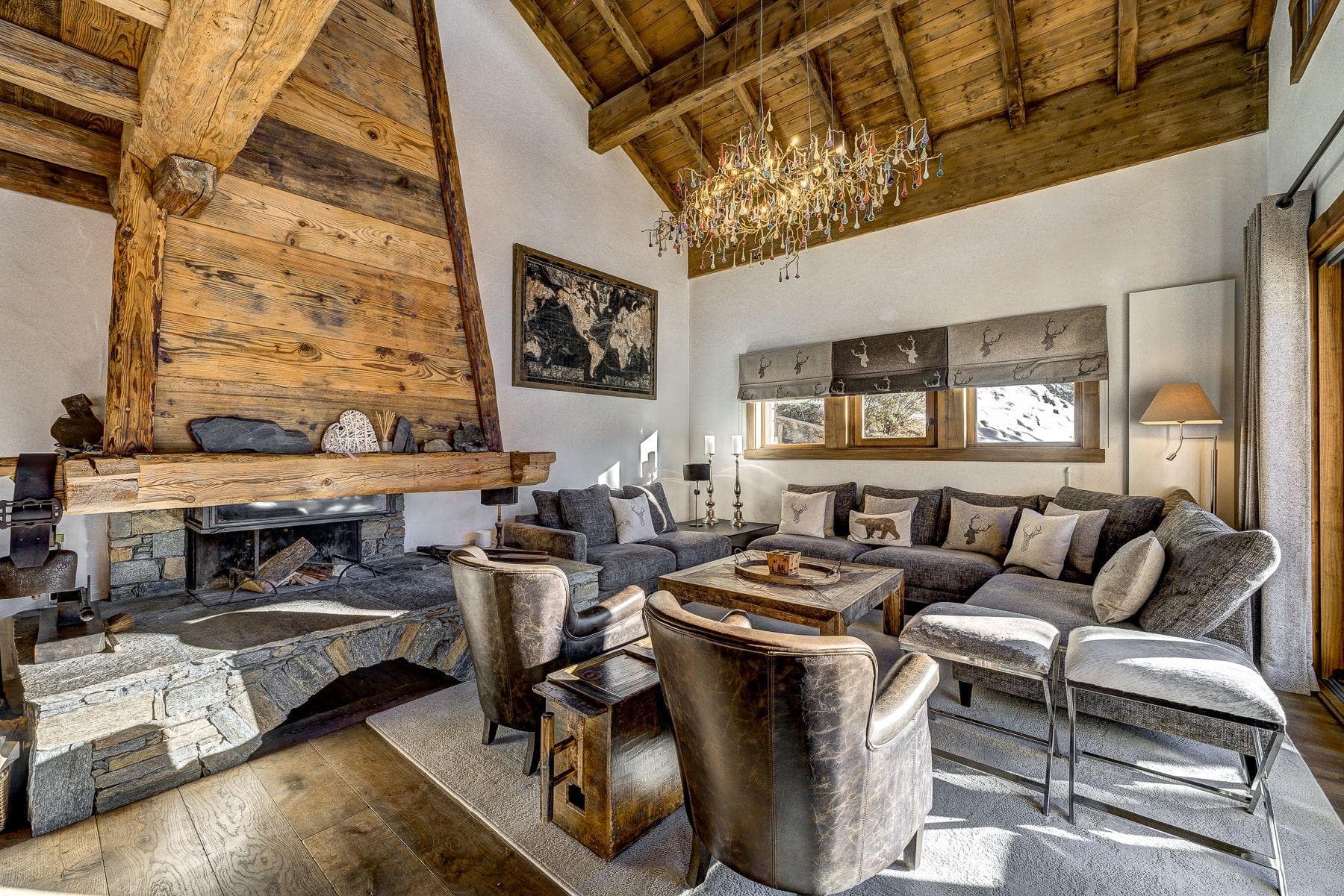 Living area with wood-burning fireplace and sectional seating for 8