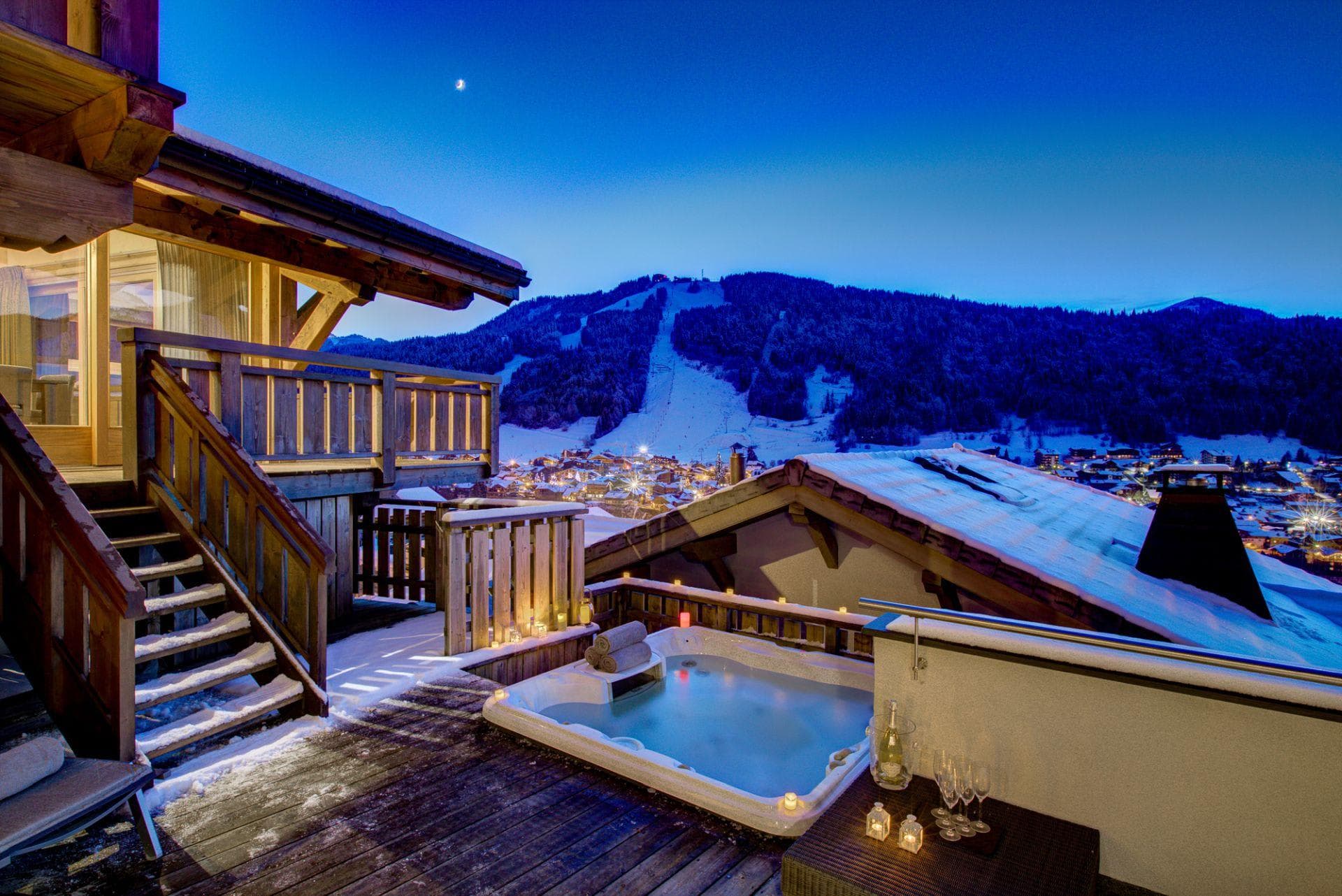 Sunken hot tub on private deck with views of the ski slopes