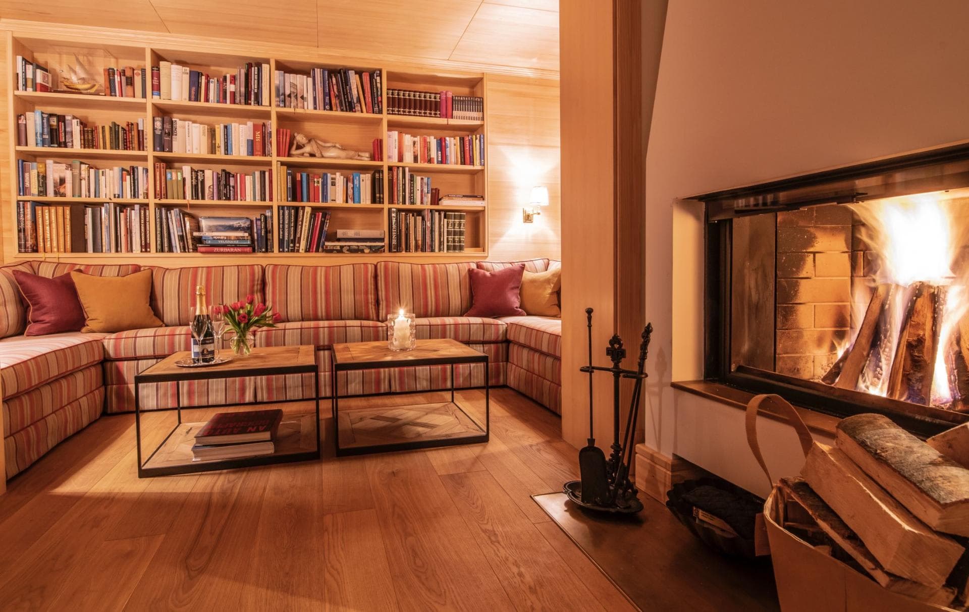 Library lounge with wood-burning fireplace and sectional seating for 8