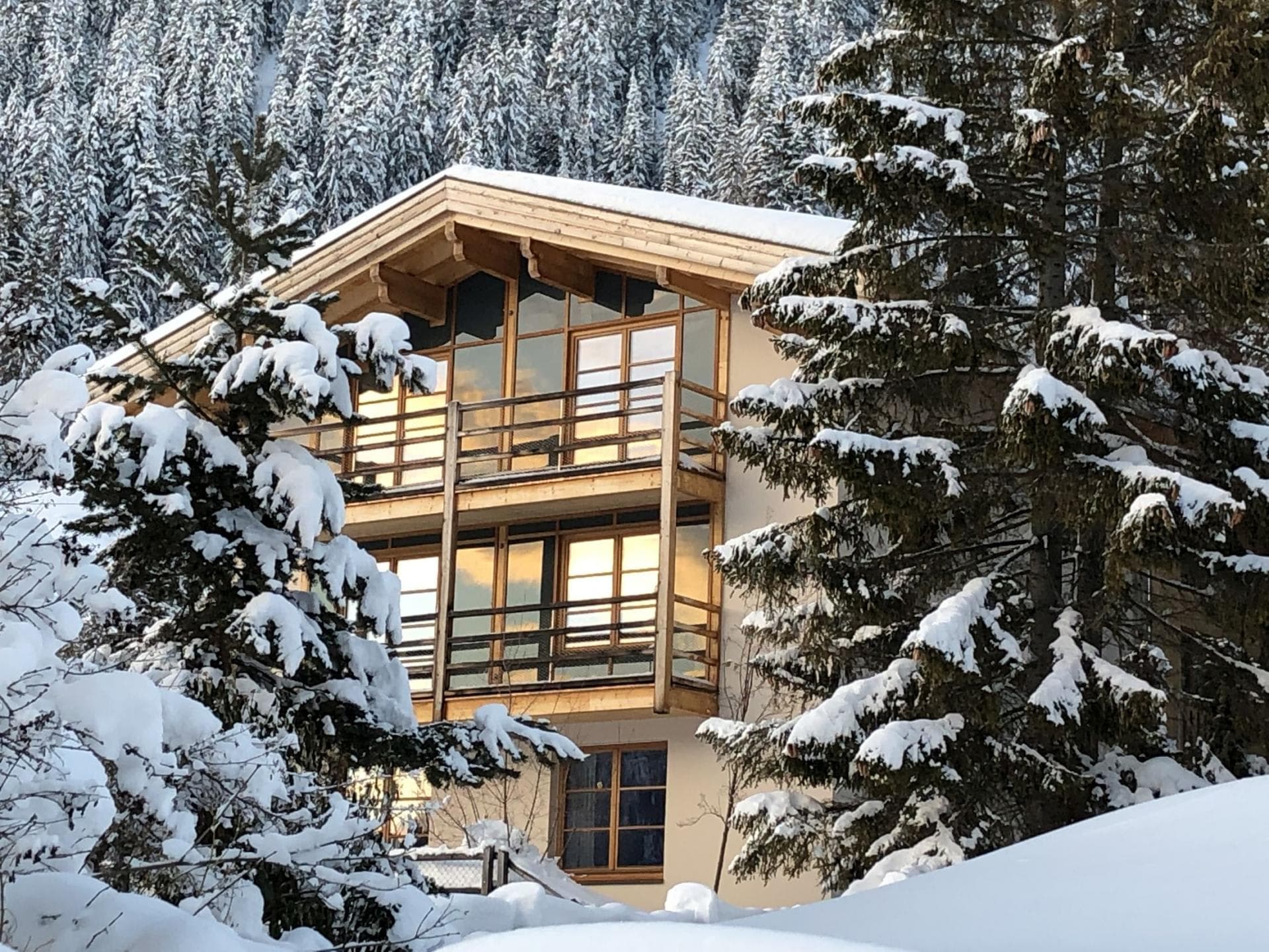 Ski-in chalet with private balconies and floor-to-ceiling windows