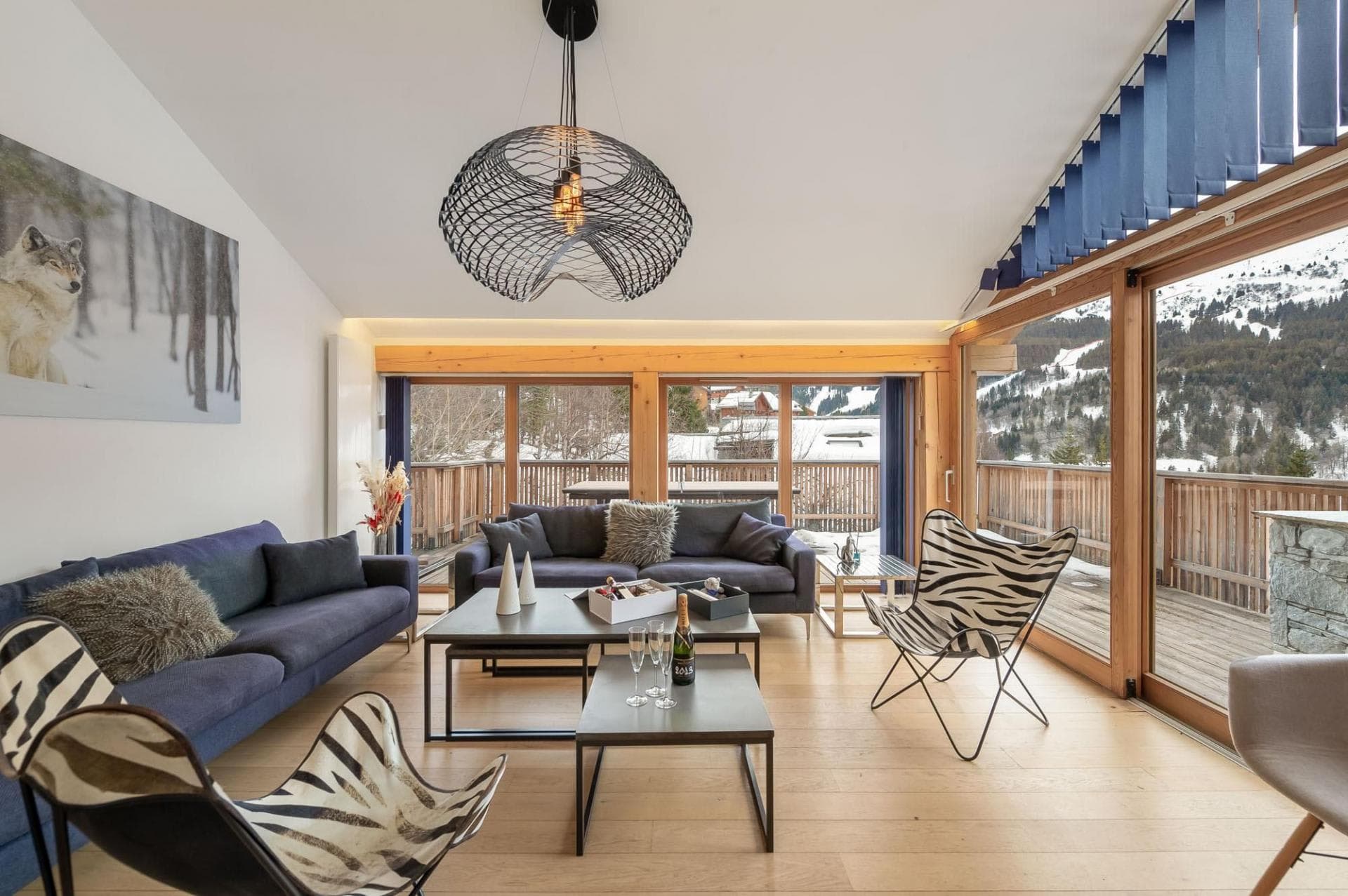 Living room with mountain views and direct deck access
