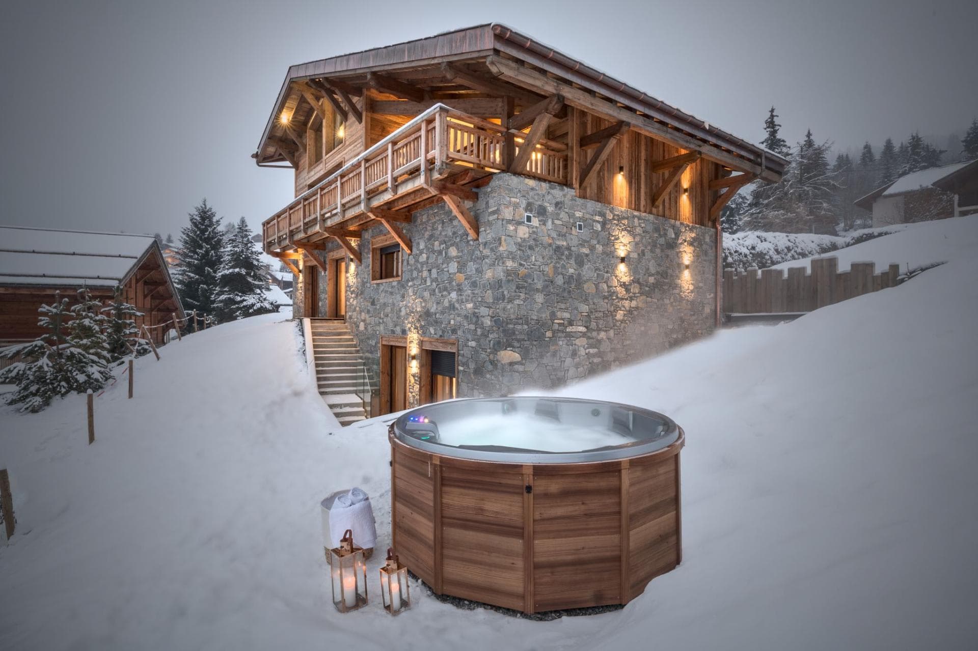 Cedar-clad outdoor hot tub; overlooks chalet with mountain views