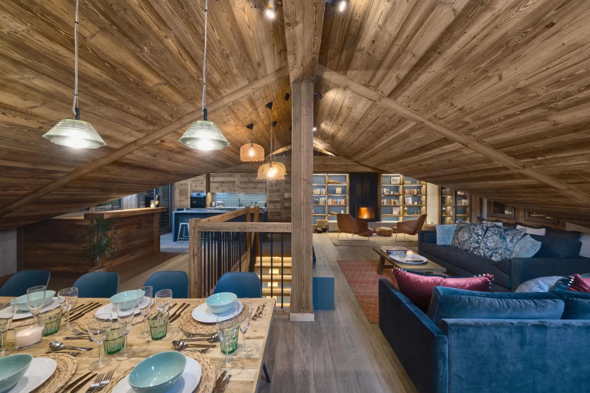 Open-plan upper level with a vaulted timber ceiling and fireplace