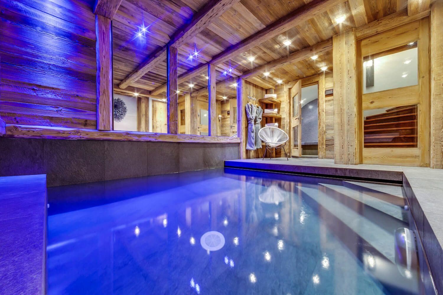 Indoor heated pool with adjacent sauna and steam room