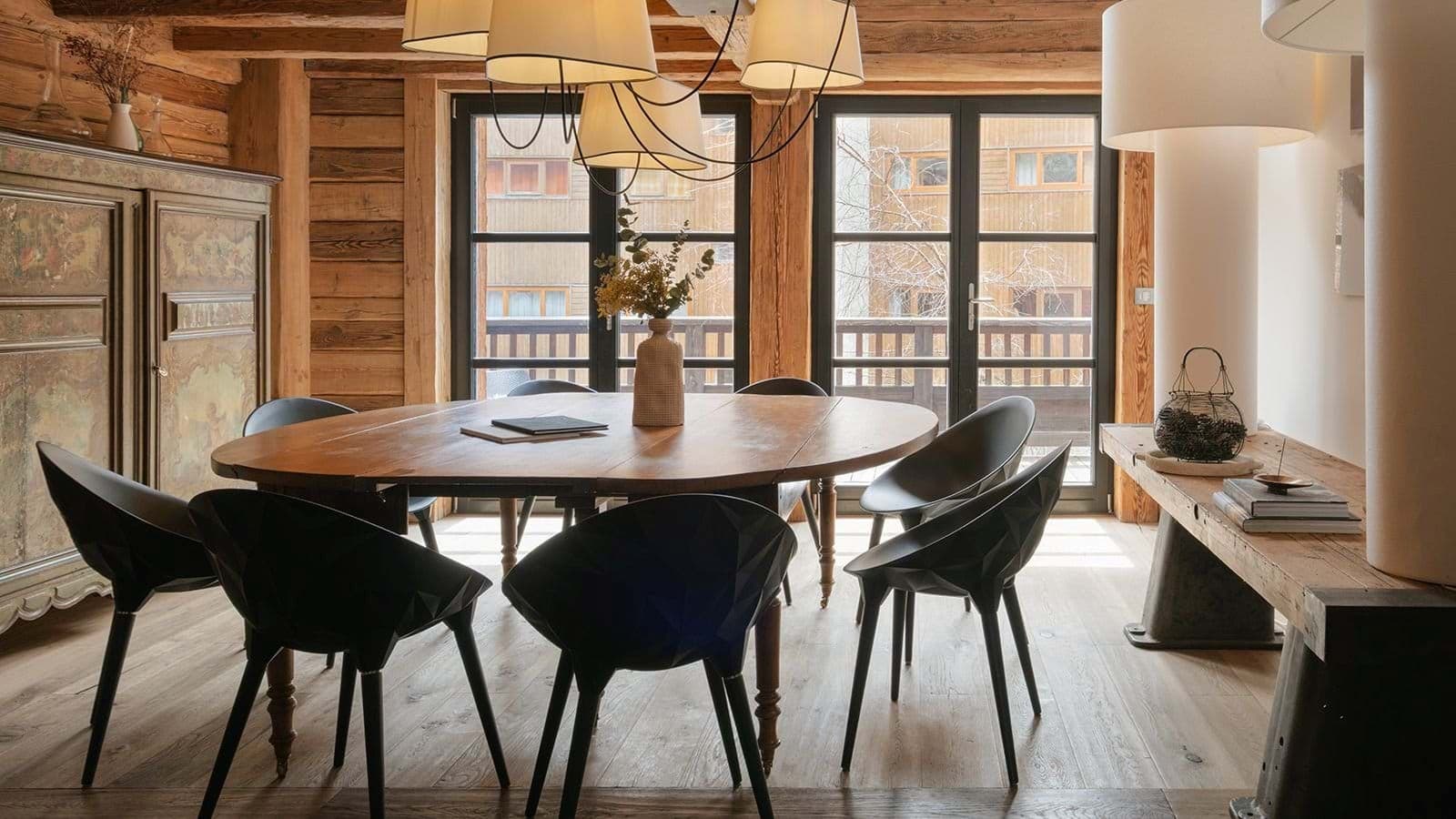Dining area seats 8; floor-to-ceiling windows with balcony access