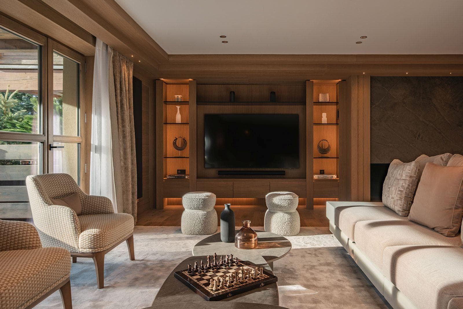 Media room with 75-inch screen, soundbar, and integrated shelving