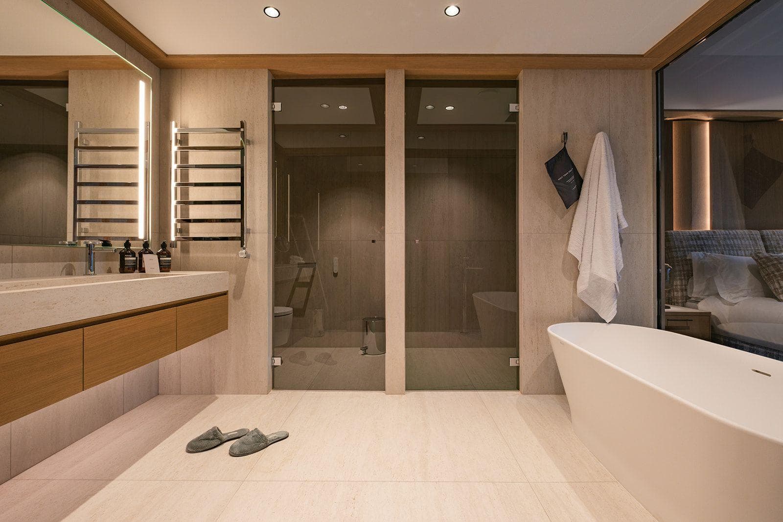 En suite bathroom with soaking tub and heated towel rack