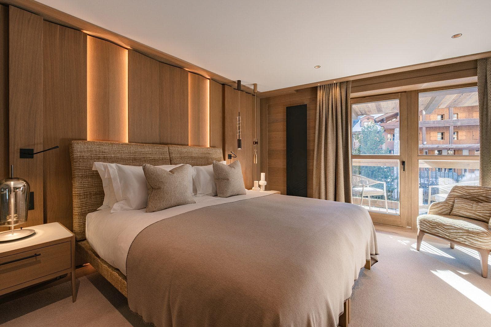 Primary bedroom with king bed and private balcony access