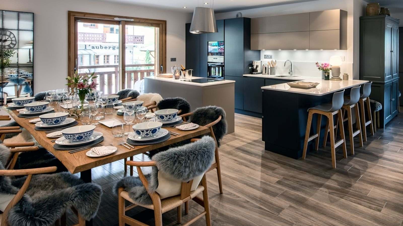 Kitchen and dining area; table seats 8 with additional breakfast bar seating