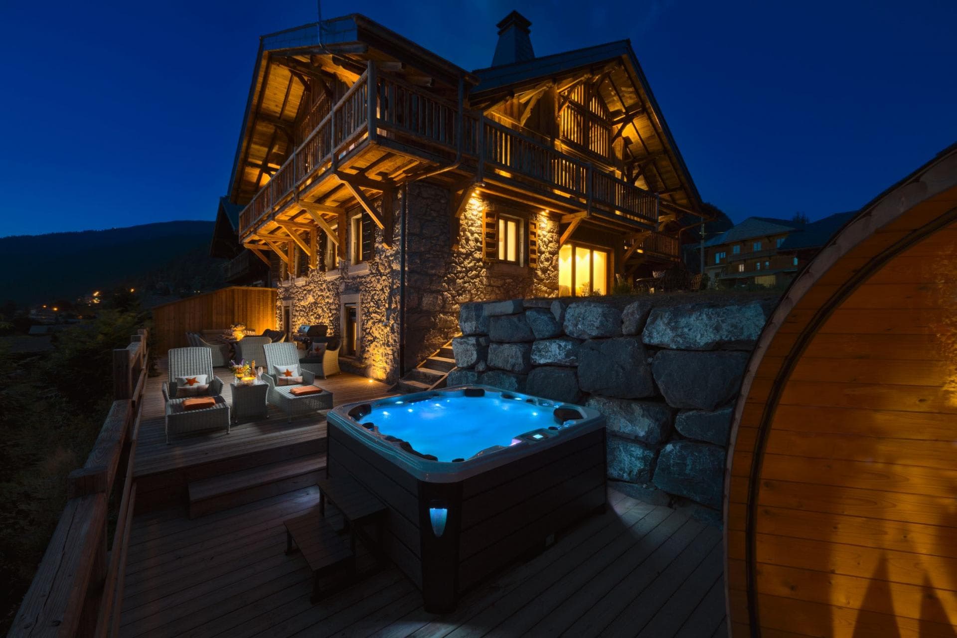 Chalet terrace with outdoor hot tub and barrel sauna